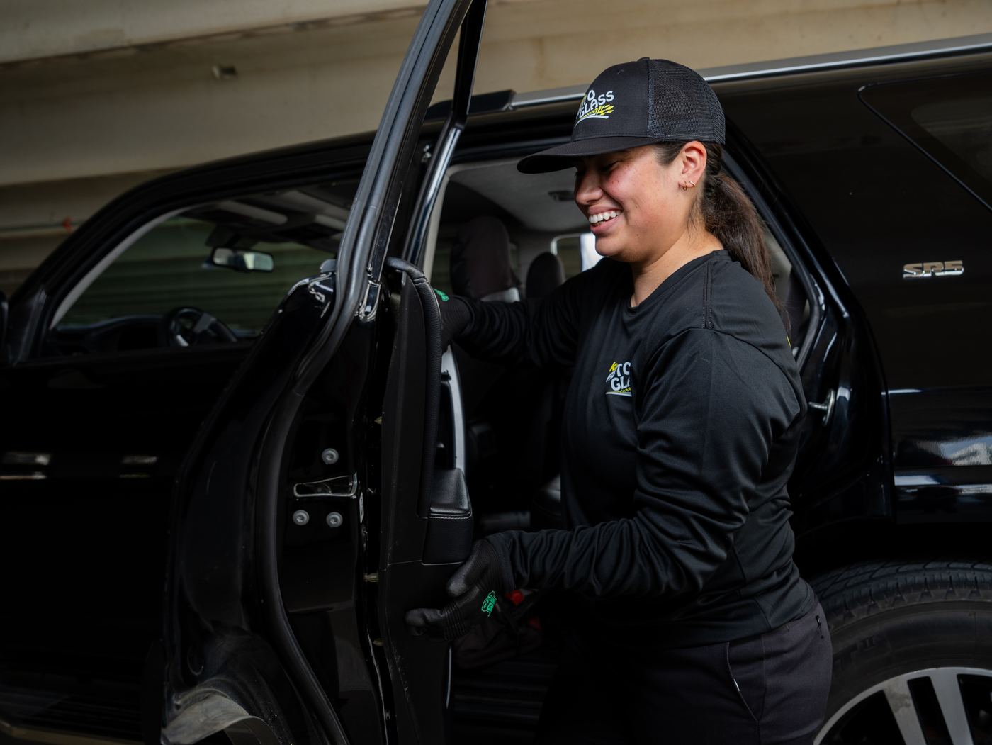 KAG technician working on a vehicle's door glass