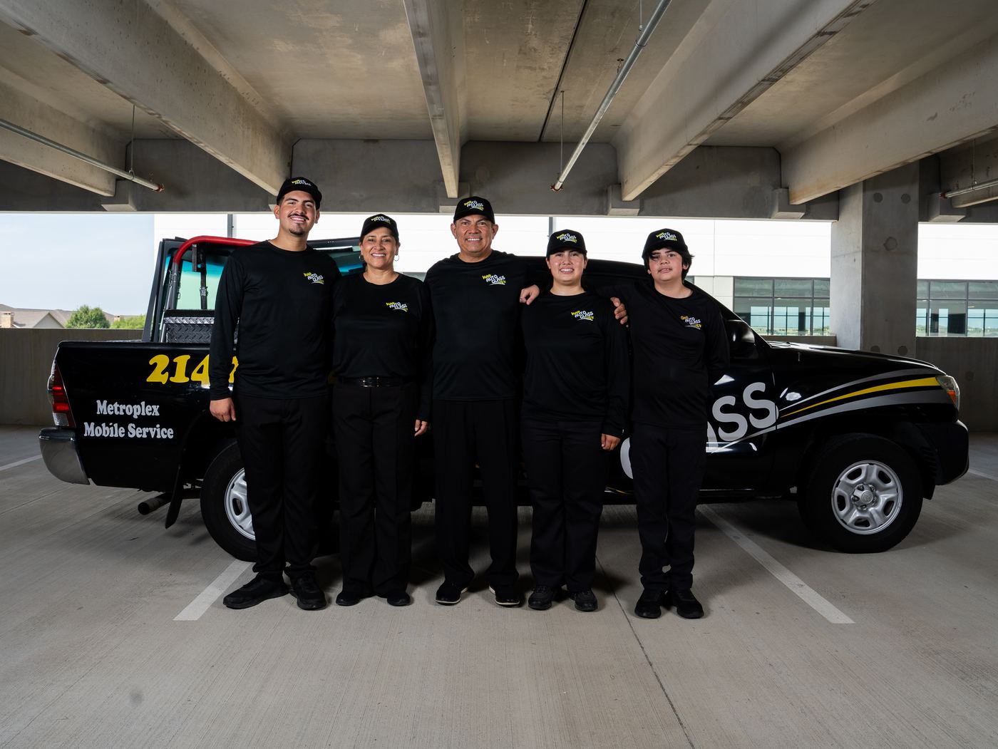 The Kaleb Auto Glass family in front of a KAG truck